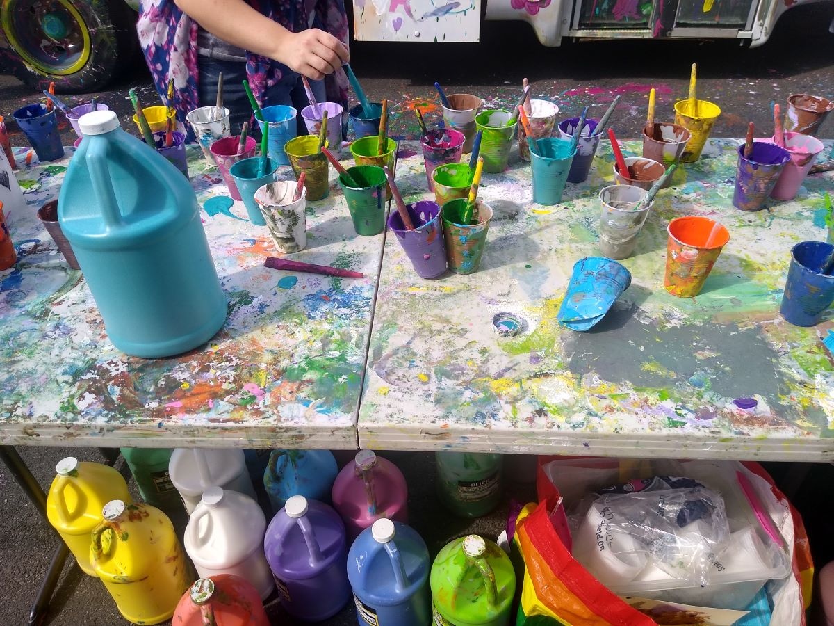 folding table covered in different types of paint
