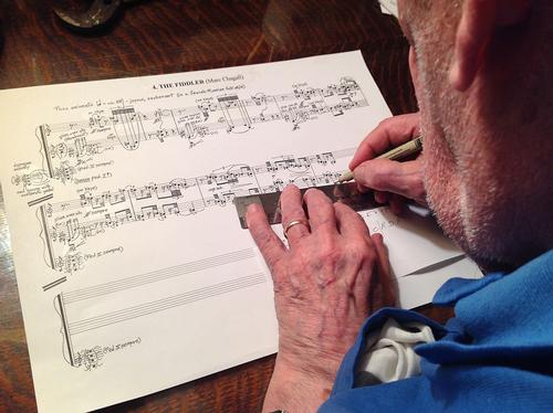 George Crumb writing out music for 