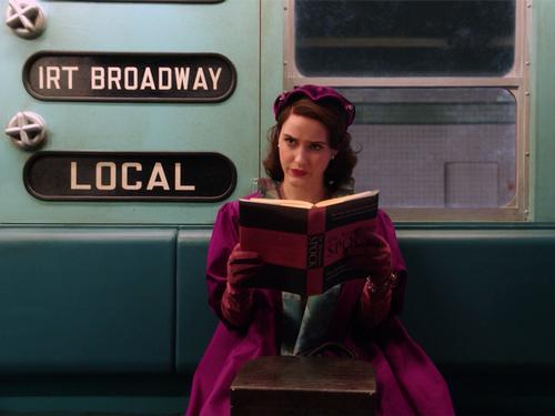 Mrs. Maisel reading on the subway.