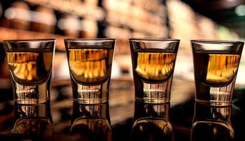 whiskey in shotglases
