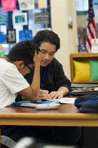 Teen Leadership assistants help younger students with homework.