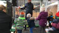Blowing bubbles at Christmas Village Storytime