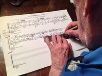 George Crumb writing out music for 