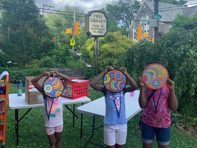 Young patrons show off their colorful creations at the Falls of Schuykill Library. 