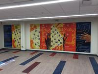 Original artwork created just for Logan Library by Ife Nii Owoo can be viewed in the Community Room on the lower level. The indoor mural, Read: A Pathway for Hope, focuses on the importance of literacy in the community.