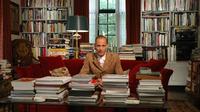 John Waters in his home library