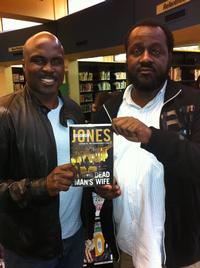 Marvin poses for a pic with Solomon Jones and one of his best-selling books.