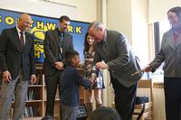 Mayor Kenney gives kindergartners their first Free Library cards at Southwark Elementary in 2017. (Photo by Samantha Madera.)