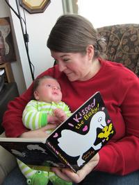Eastwick Branch Librarian Tara reads to her baby!