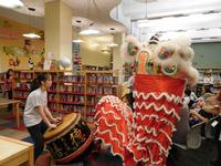 Holy Redeemer School students performing the traditional Lion Dance with drummers at Independence Library.