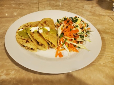 plate of tacos and mixed vegetables