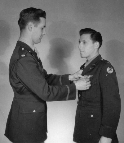 Man receiving Air Force medal pinned to lapel